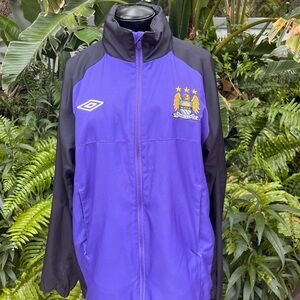 Manchester City Football Club jacket.